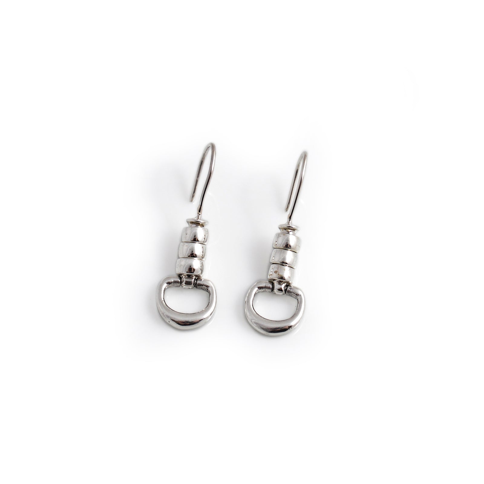 Pair of silver earrings on a white background
